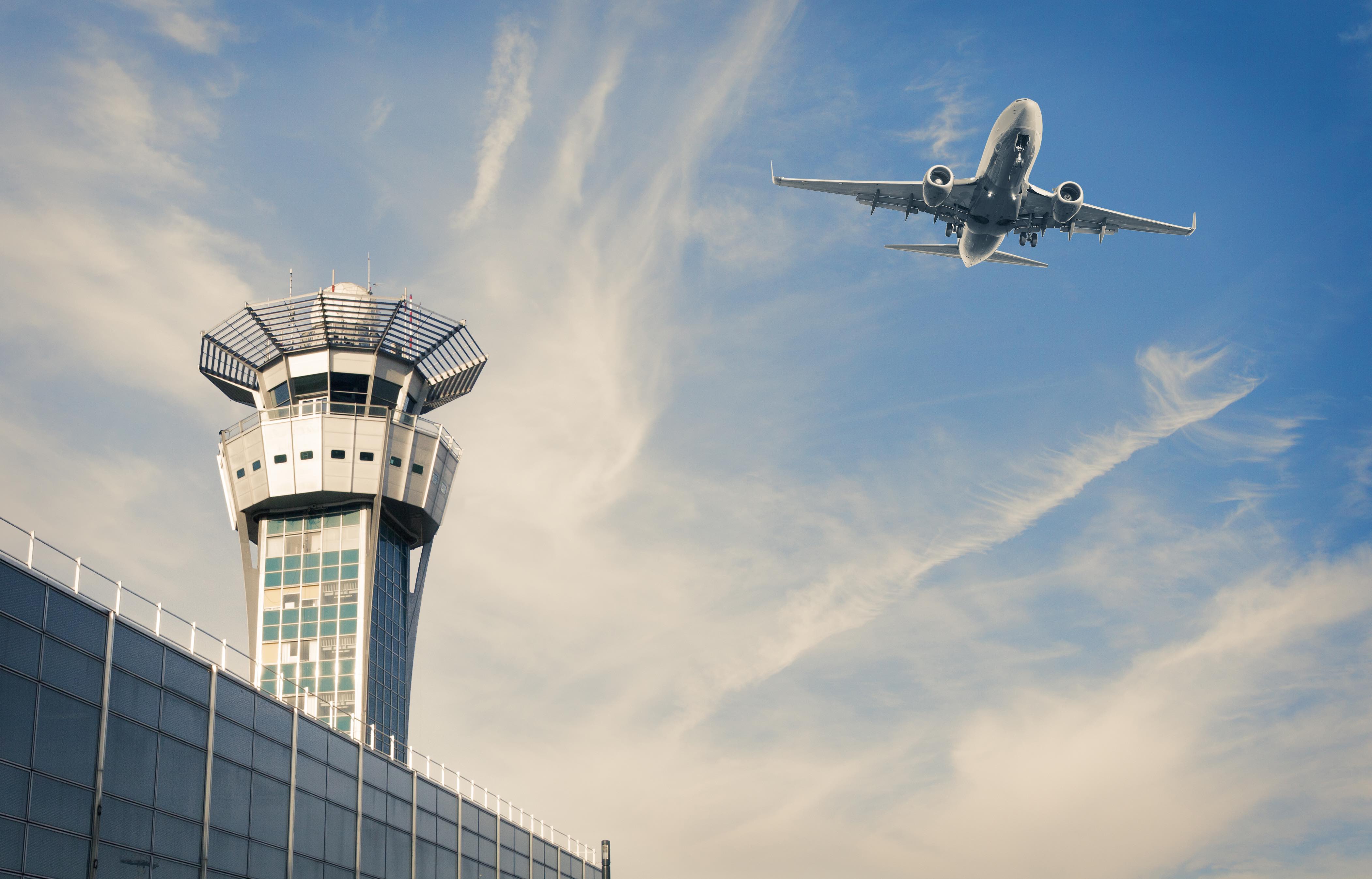 Air Trafic Control tower and airplance at Paris Airport